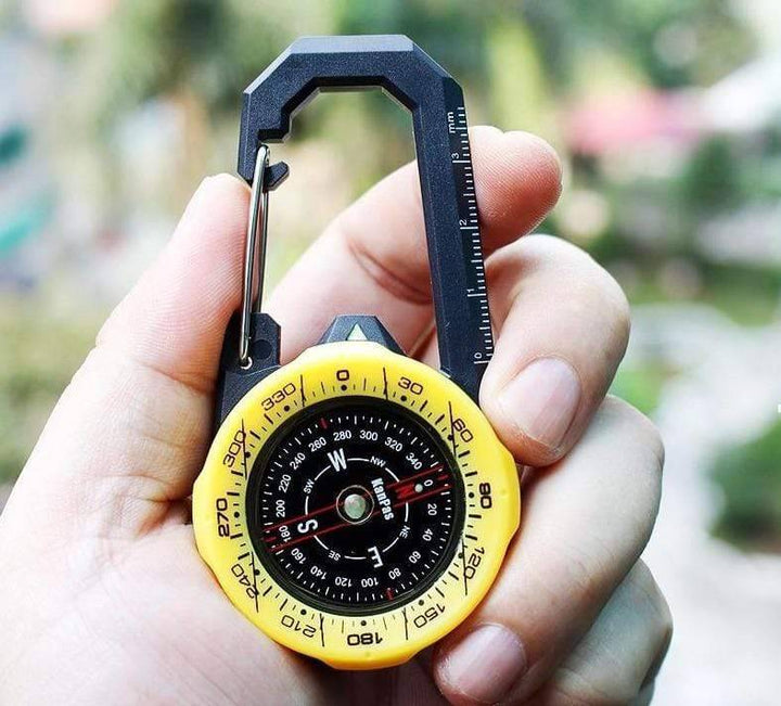 Survival compass with integrated carabiner, an essential piece of outdoor adventure gear.