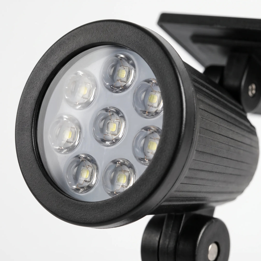 Wireless waterproof solar spotlight, ideal for pathways, gardens, and wall mounted outdoor lighting.