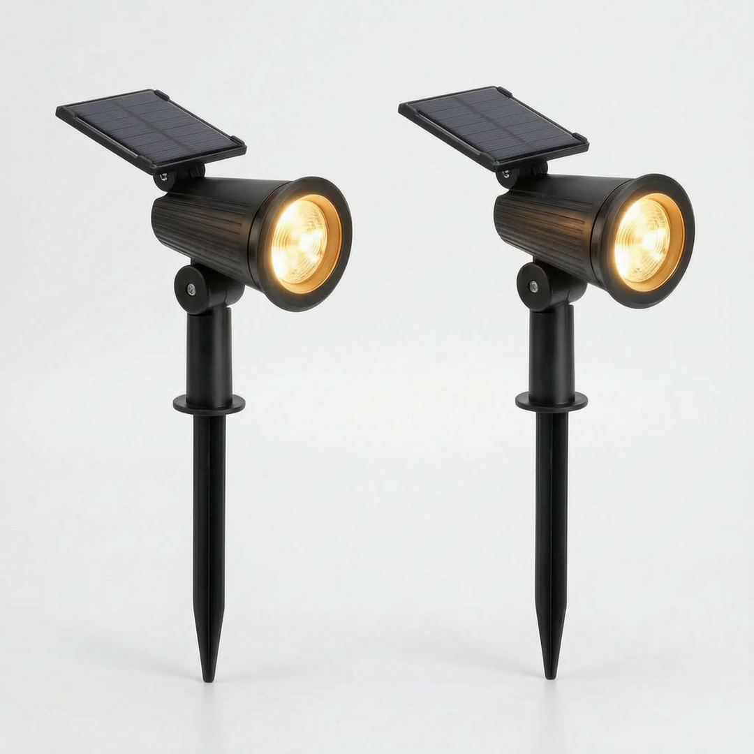 Solar powered outdoor spotlight with adjustable head, waterproof for garden and patio areas.