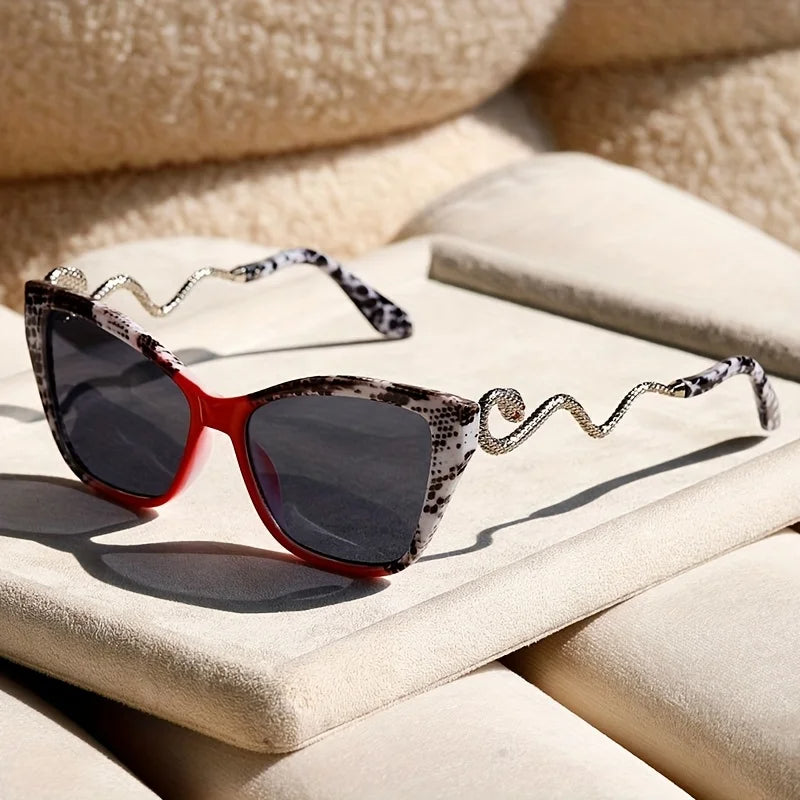 Fashion-forward women's oversized cat-eye sunglasses, gradient lenses, elegant snake arms.
