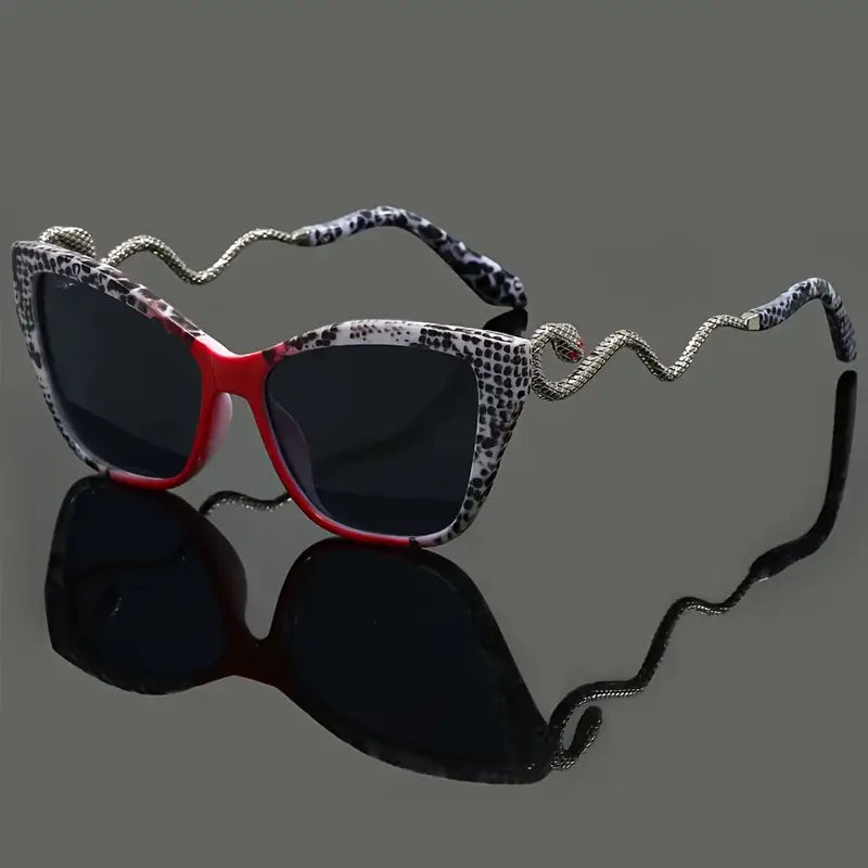Women's fashion sunglasses: oversized cat-eye frame, striking snake arm, UV protective.