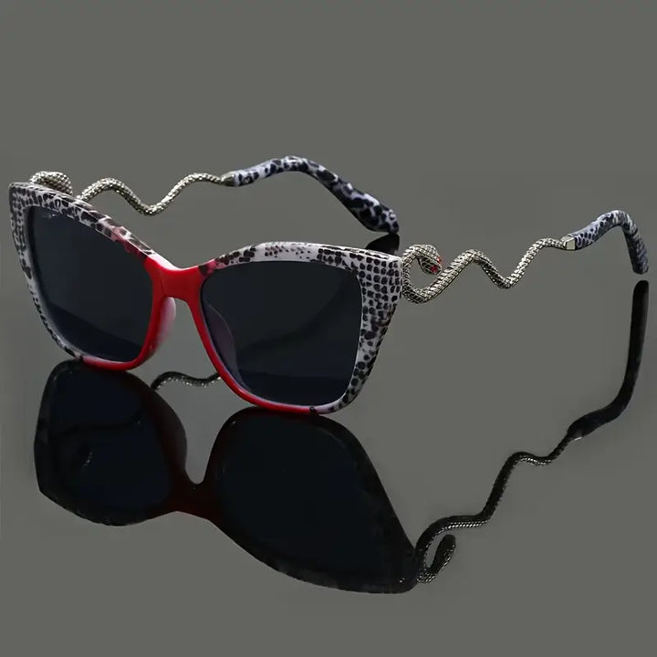 Women's fashion sunglasses: oversized cat-eye frame, striking snake arm, UV protective.