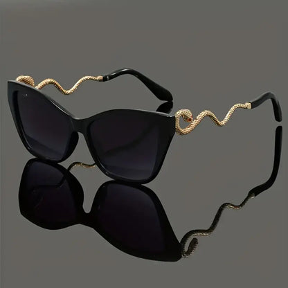 Stylish oversized cat-eye sunglasses with unique snake arms for women. Perfect fashion statement.