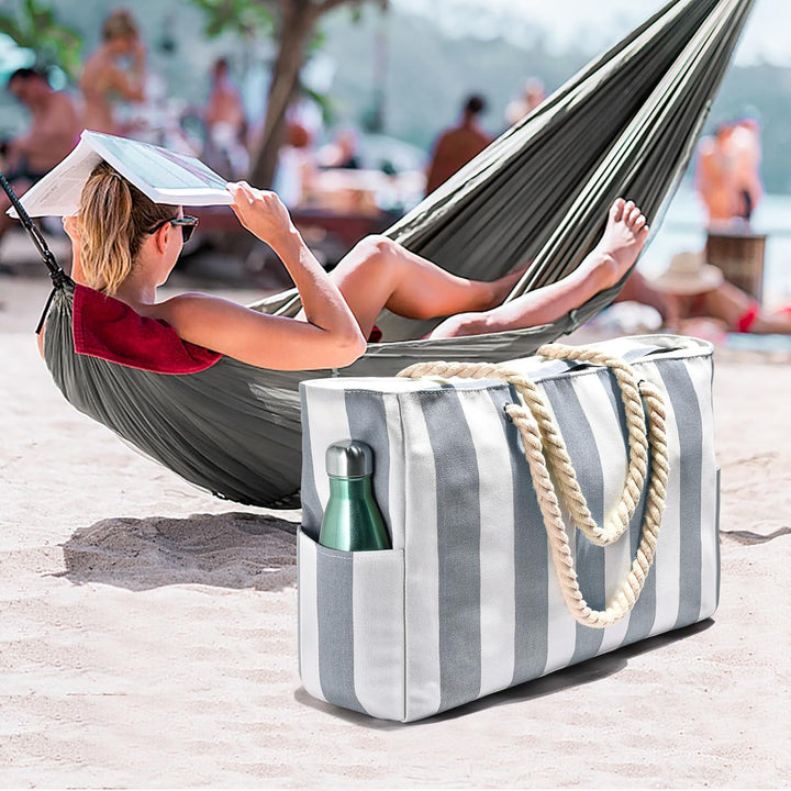 Durable women's oversized beach tote, waterproof & sandproof, great for summer travel.