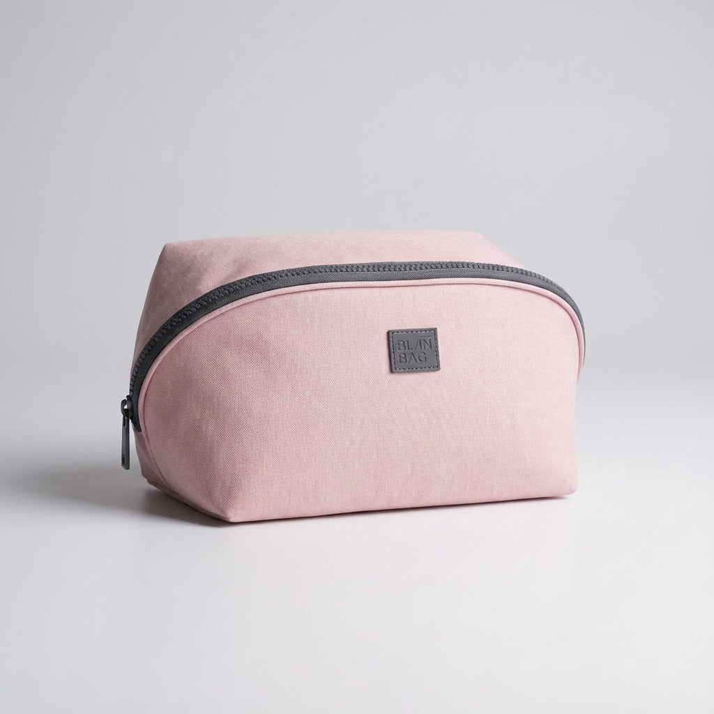 Unisex travel toiletry bag with multiple compartments & zipper pockets for organized packing of cosmetics & essentials.