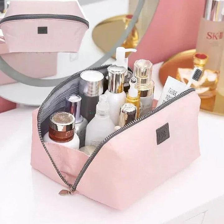 Handy travel organizer toiletry bag for toiletries, cosmetics, and travel essentials. Keeps luggage neat.