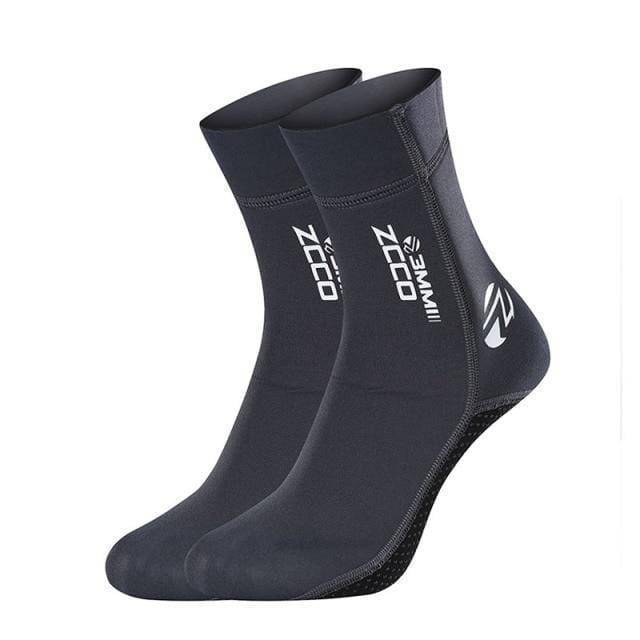 Stack of folded neoprene diving water socks in black, highlighting their compact design and swimwear accessory appeal.