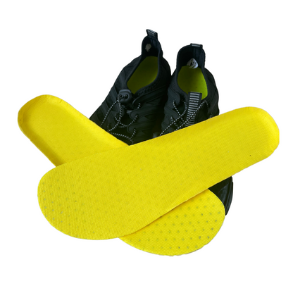 Close-up of flexible barefoot shoe insoles showing textured surface for enhanced grip & foot health.