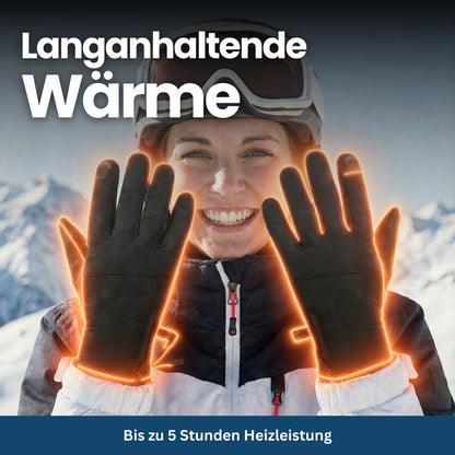Person wearing black heated gloves while skiing, demonstrating their utility for winter sports and warmth.