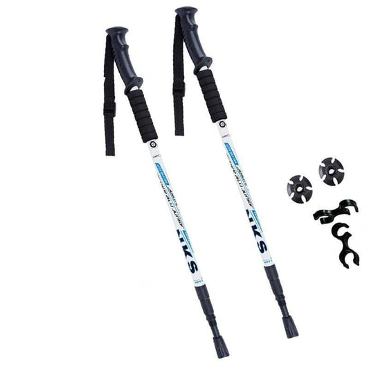 Pair of silver unisex anti-shock trekking poles for hiking, adjustable aluminum with ergonomic black grips.