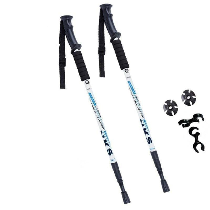Pair of silver unisex anti-shock trekking poles for hiking, adjustable aluminum with ergonomic black grips.