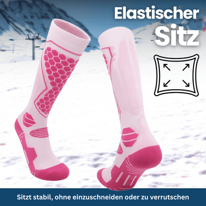 Set of three pairs of colorful thermal winter ski socks: blue, red, and black, stacked