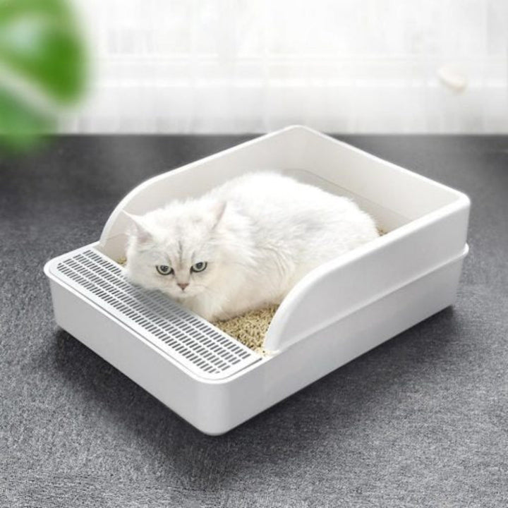 No Mess Cat Litter Tray for pet care. Features high walls to contain litter & a scoop for easy cleaning.