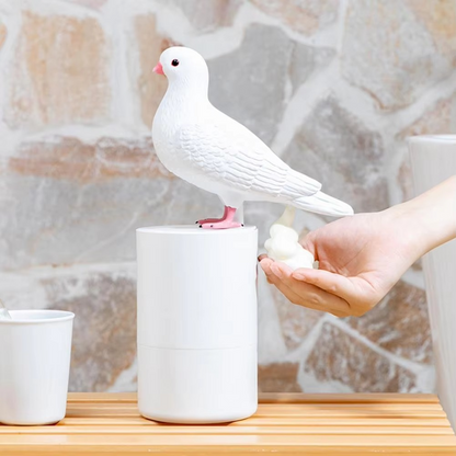 Touchless Pigeon foam soap dispenser next to a kitchen sink, providing convenient and hygienic hand washing.
