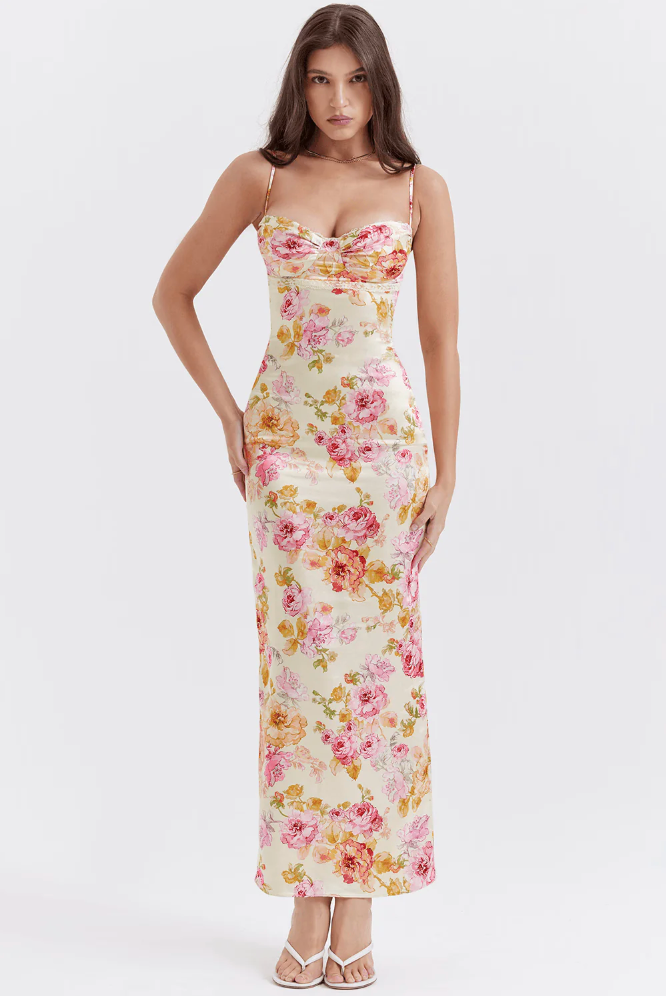 Pink floral maxi slip dress with corset detail, perfect for a romantic wedding guest outfit.