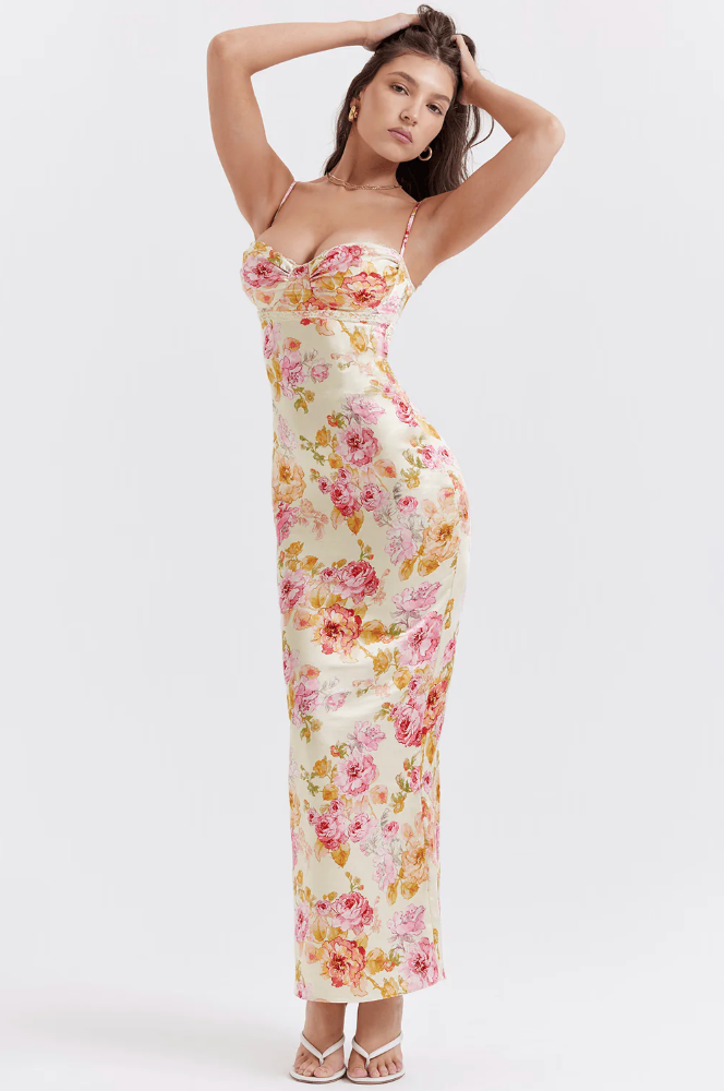 Women's romantic pink floral print maxi slip dress with a stylish corset design, perfect for special occasions.