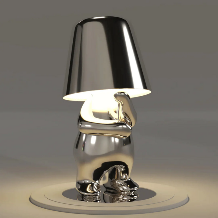 Artistic dimmable LED table lamp, playful design, enhances interior decor.