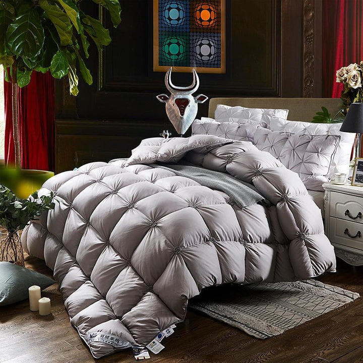 Warm goose down duvet, a luxurious quilted blanket for cozy nights & ultimate bedroom comfort.