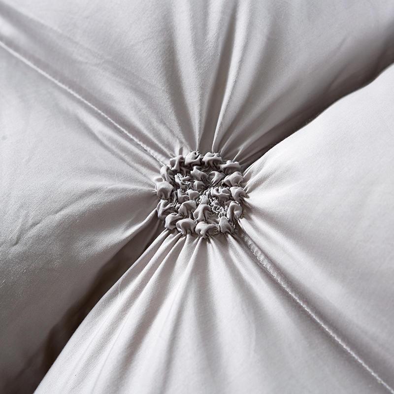 Elegant quilted goose down duvet, a warm blanket for luxurious home comfort & bedroom decor.