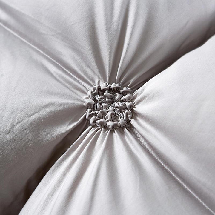 Elegant quilted goose down duvet, a warm blanket for luxurious home comfort & bedroom decor.