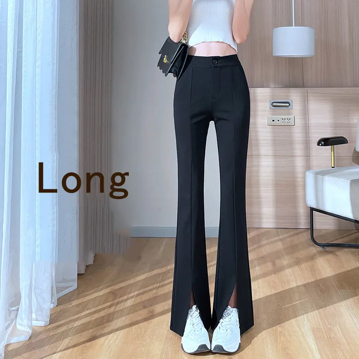 Elegant women's plus size black flared slit pants. High-waisted for a flattering fit, modern retro fashion.