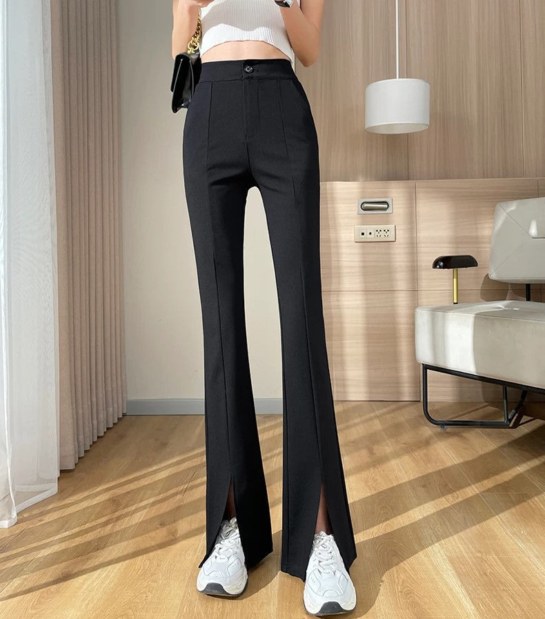 Women's plus size black pants: high-waisted, flared, and featuring chic leg slits. Elegant & versatile.