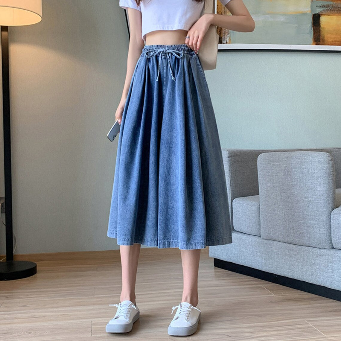Close-up of comfortable plus-size denim skirt-pants, showcasing the wide leg and quality fabric.