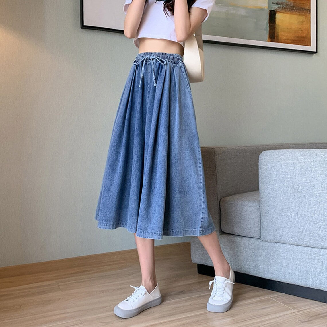 Women's classic plus-size wide-leg denim skirt-pants. Midi length, high waist, and comfortable fit.