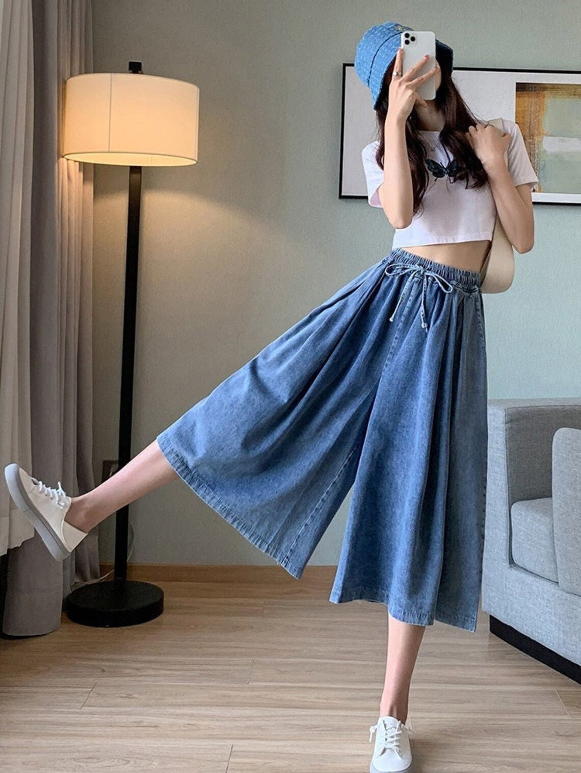 Comfortable plus-size denim skirt-pants for women, featuring a classic wide leg and versatile midi style.