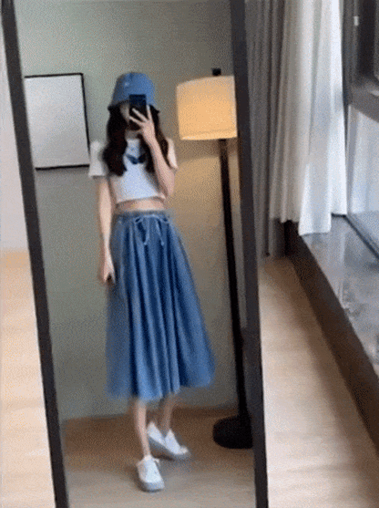 Stylish high-waist plus-size denim skirt-pants with a chic wide leg, ideal for a comfortable, modern look.
