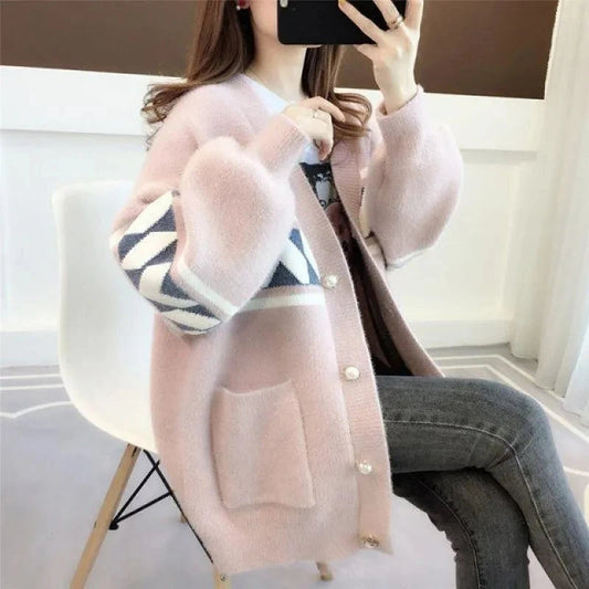 Plus size women's cozy sweater, oversized, with button detail, perfect for casual fall or winter wear.