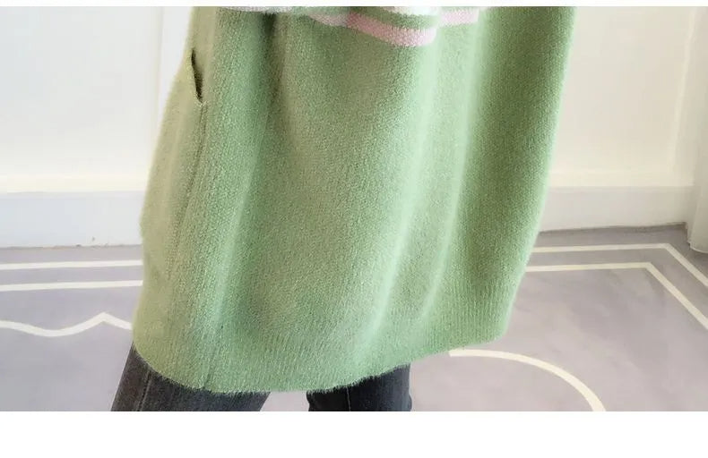 Fall fashion: comfortable plus size women's sweater, loose fit, featuring subtle button details.