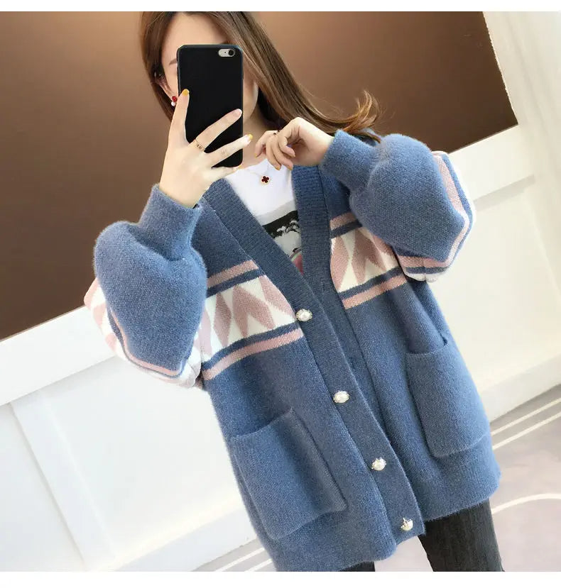 Fashionable plus size top for women, casual wear, comfortable & warm, ideal for any season.