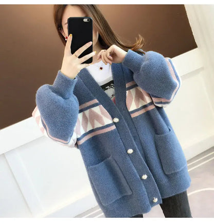 Fashionable plus size top for women, casual wear, comfortable & warm, ideal for any season.