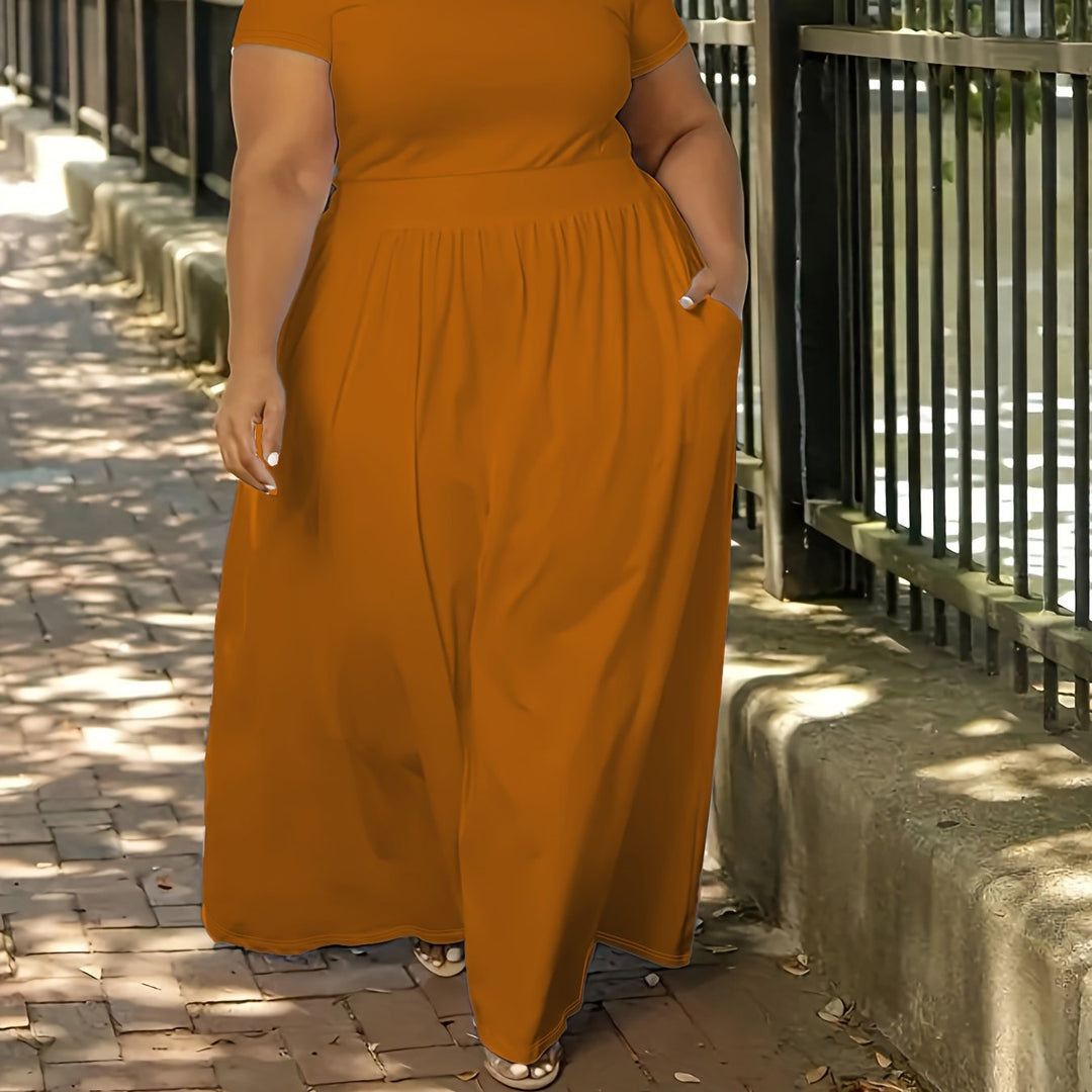 Women's plus size flowy short sleeve maxi dress with pockets, comfortable for everyday.