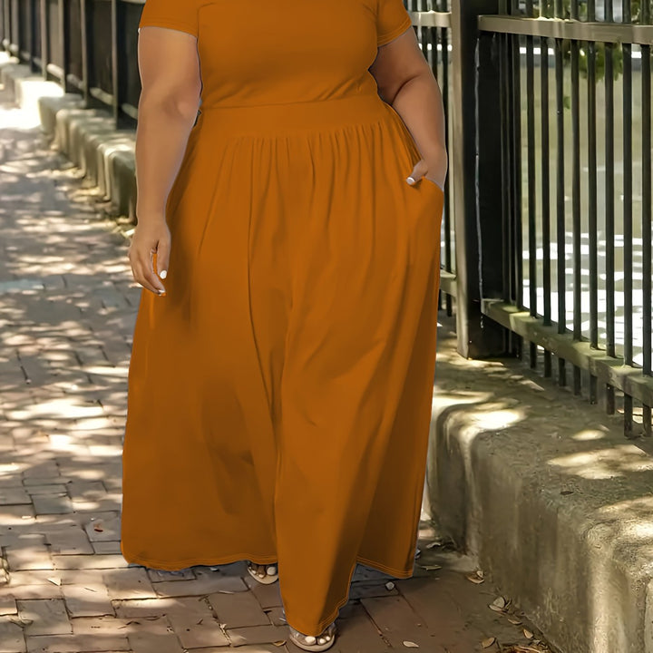 Women's plus size flowy short sleeve maxi dress with pockets, comfortable for everyday.