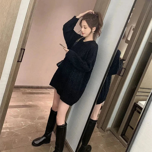 Plus size women's oversized cozy sweater with relaxed fit, long sleeves, & round neck, perfect for fall & winter.