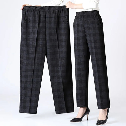 Plus size women's warm black fleece trousers with flexible waist for winter comfort.