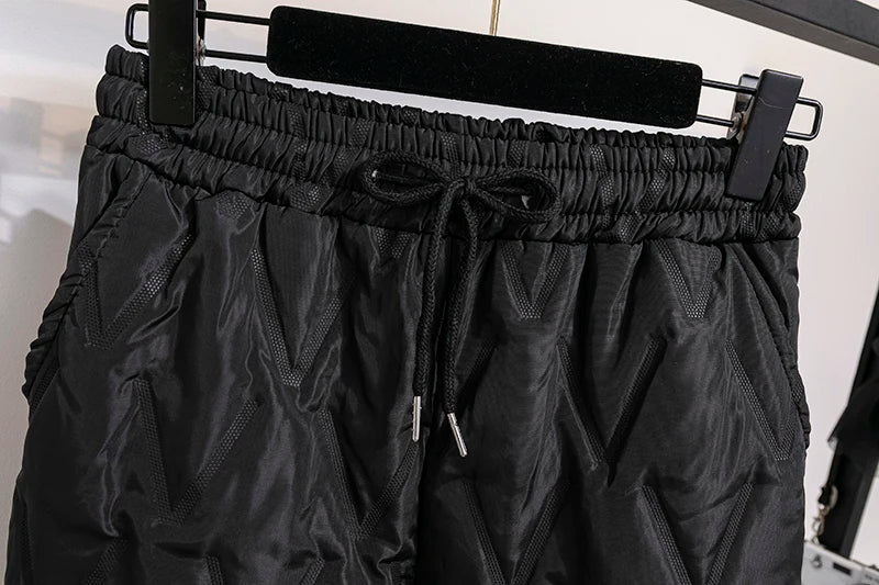 Women's plus size thermal joggers with practical pockets, warm & comfortable for winter.
