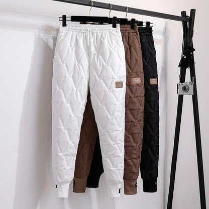 Woman stretching in comfortable plus size thermal winter pants, perfect for flexible movement.