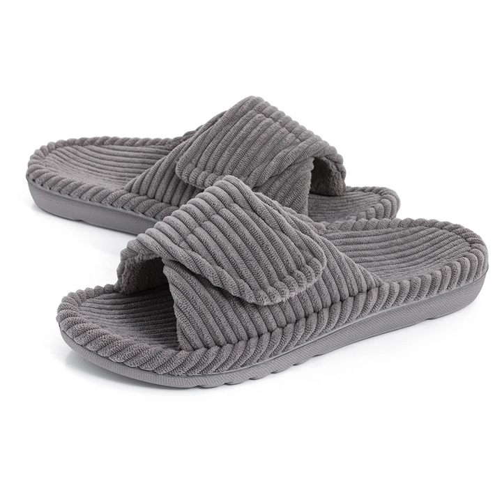 Side view: Women's plush adjustable comfort slides, offering cushioned support for indoor-outdoor wear.