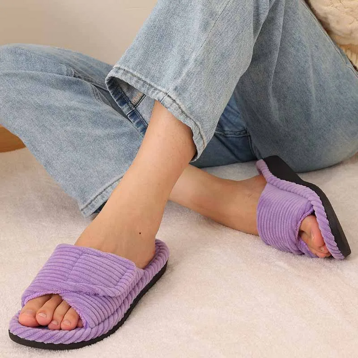 Women's adjustable plush slides; ergonomic design provides personalized comfort for indoor/outdoor use.
