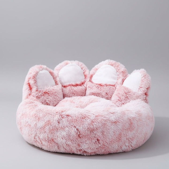 Happy dog relaxing in a plush calming sofa bed, featuring a removable, machine-washable cover for easy cleaning.
