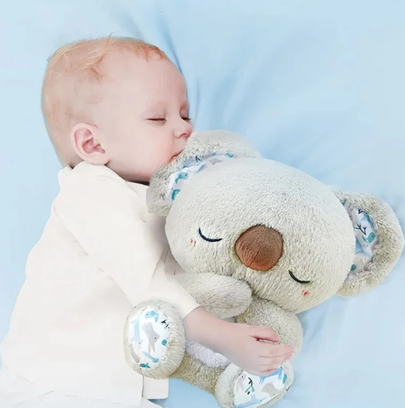 Calming Koala sleep aid toy demonstrating gentle breathing motion and a soft night light for stress reduction.