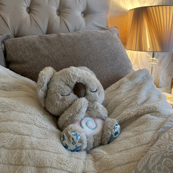 Soft plush Koala breathing sleep aid toy, designed to reduce stress and provide a soothing presence for all ages.