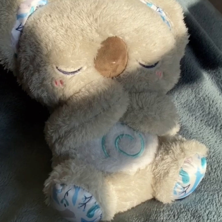 Koala relaxation toy with breathing motion, a comforting plush companion for sleep, anxiety, and stress relief.