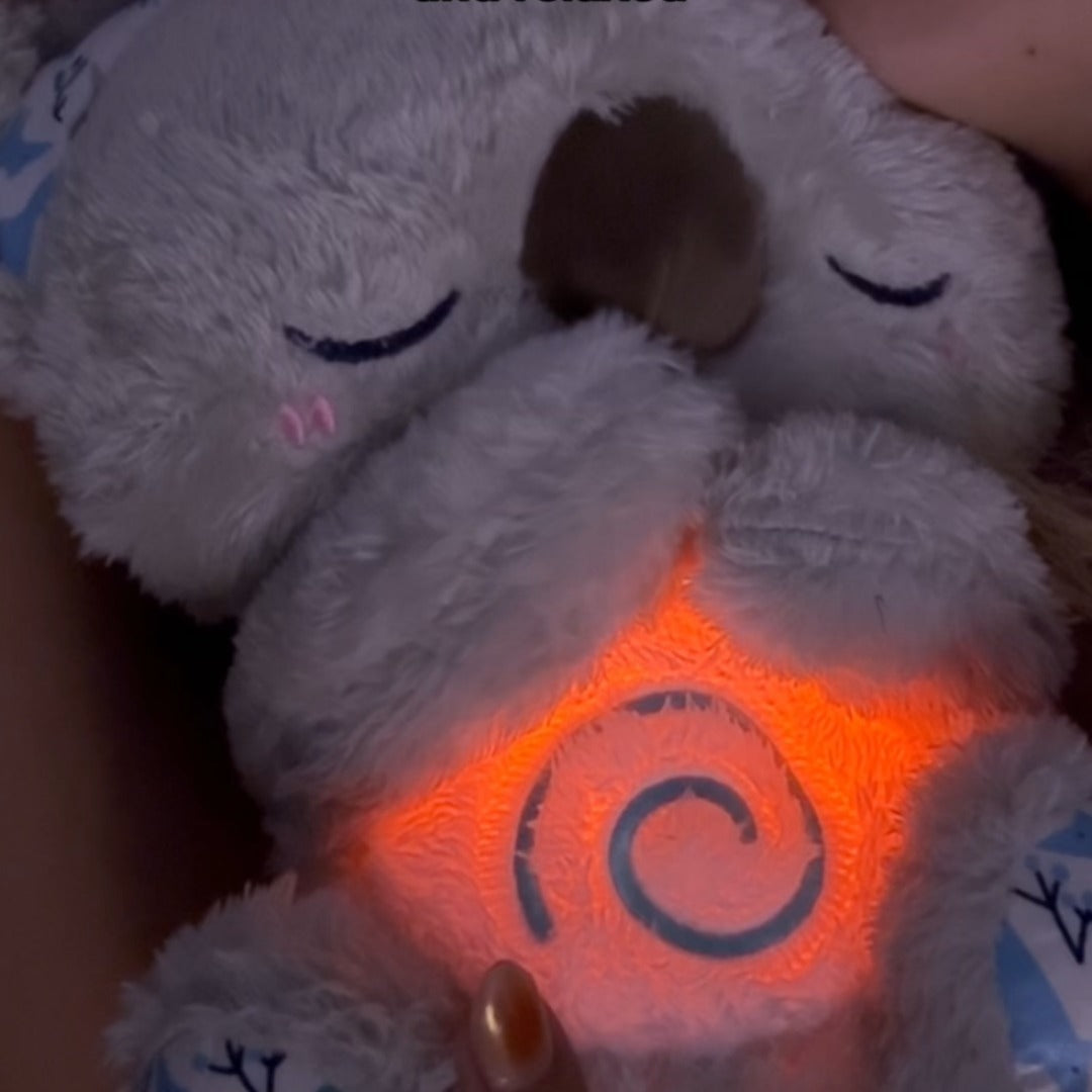Unisex Calming Koala plush, a soothing breathing sleep aid and night light for anxiety and stress reduction.