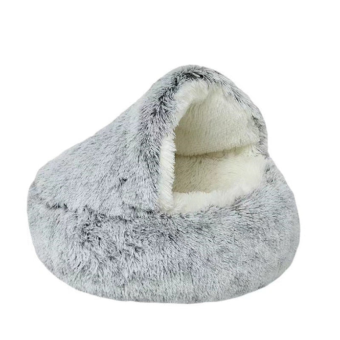 Soft plush cat bed, a comfortable donut-shaped haven, easily washable for hygiene.