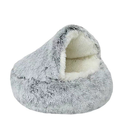 Soft plush cat bed, a comfortable donut-shaped haven, easily washable for hygiene.