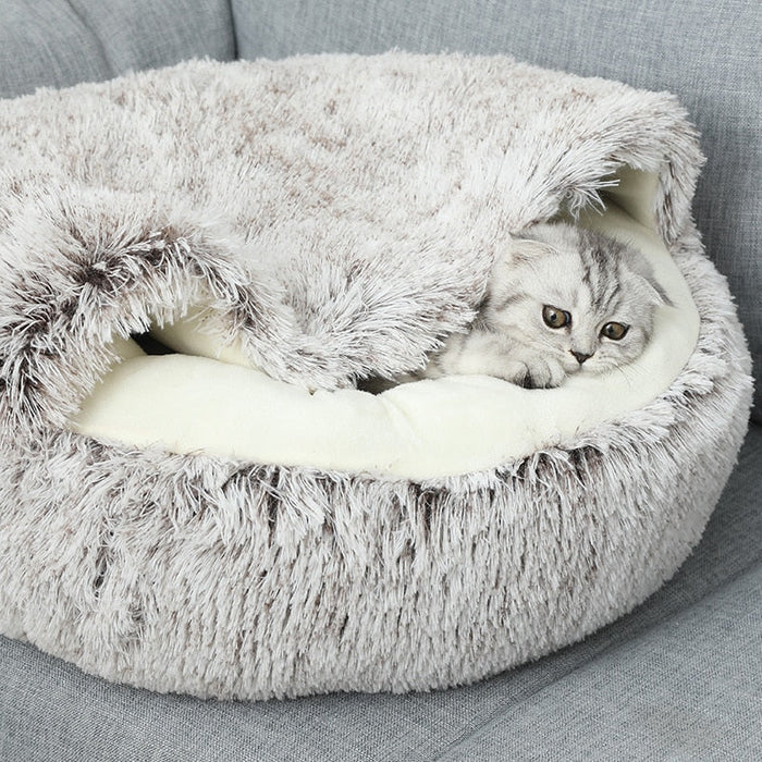 Comfortable donut pet bed for cats & small dogs, providing a warm, cozy, and secure sleeping spot.